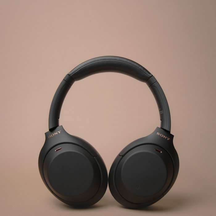 Black wireless headphones on white table